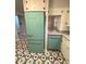 This kitchen showcases a unique retro-style refrigerator with matching backsplash at 612 Brown Ave, Albemarle, NC 28001