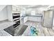 Modern kitchen featuring white cabinets, stainless steel appliances, and granite countertops at 405 Aquadale Rd, Albemarle, NC 28001