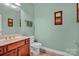 Clean bathroom with wood vanity and tiled floor at 121 Pebble Creek Dr, Stony Point, NC 28678