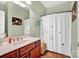 Bathroom with wood vanity, shower, and tiled floor at 121 Pebble Creek Dr, Stony Point, NC 28678