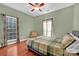 Bedroom with hardwood floors and plaid bedding at 121 Pebble Creek Dr, Stony Point, NC 28678
