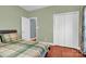 Bedroom with hardwood floors, double doors, and window at 121 Pebble Creek Dr, Stony Point, NC 28678