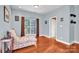 Relaxing bedroom with hardwood floors and a chaise lounge at 121 Pebble Creek Dr, Stony Point, NC 28678
