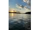 Sunset over calm lake water with cloudy sky at 121 Pebble Creek Dr, Stony Point, NC 28678