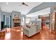 Spacious living room with stone fireplace and hardwood floors at 121 Pebble Creek Dr, Stony Point, NC 28678