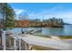 Scenic lakefront property featuring a private dock, perfect for boating and enjoying waterfront living at 121 Pebble Creek Dr, Stony Point, NC 28678