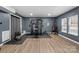 Basement home gym with weight rack and punching bag at 15827 Arabian Mews Ln, Charlotte, NC 28278