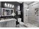 Modern bathroom with a walk-in shower and sleek black and white finishes at 15827 Arabian Mews Ln, Charlotte, NC 28278