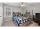 Bedroom with plaid bedding and built-in dresser at 15827 Arabian Mews Ln, Charlotte, NC 28278