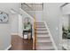 Elegant staircase with iron railings leading to the second floor at 15827 Arabian Mews Ln, Charlotte, NC 28278