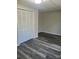 A comfortable bedroom featuring sleek wood-look flooring and a spacious closet at 230 Ellen St, Salisbury, NC 28146