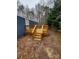 Outdoor deck with natural wood, wood railing, and steps to the yard at 230 Ellen St, Salisbury, NC 28146