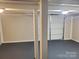 Spacious garage with an expansive garage door and ample room for vehicles and storage at 230 Ellen St, Salisbury, NC 28146