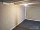 A spacious garage with an interior room and overhead lighting at 230 Ellen St, Salisbury, NC 28146