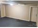 A clean and well-lit garage with a side exit door at 230 Ellen St, Salisbury, NC 28146