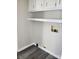 Functional utility room with built-in shelving and convenient washer hookups at 230 Ellen St, Salisbury, NC 28146