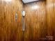 Interior wood-paneled elevator with call button at 8525 Double Eagle Gate Way # 2, Charlotte, NC 28210