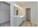 Bright bathroom with double vanity,light fixtures and walk-in closet at 1229 Red River Dr, Salisbury, NC 28144