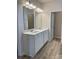 Double vanity bathroom with white cabinets and quartz countertops at 1229 Red River Dr, Salisbury, NC 28144