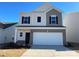 Two-story home with neutral siding and a two-car garage at 1229 Red River Dr, Salisbury, NC 28144