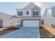 Two-story house with neutral siding and a white garage door at 1229 Red River Dr, Salisbury, NC 28144