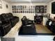 Basement home theater with tiered seating and a wet bar at 110 Silver Oak Cir, Rockwell, NC 28138