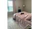 Cozy bedroom with a cat lounging on the bed at 110 Silver Oak Cir, Rockwell, NC 28138