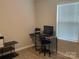 Cozy bedroom with a window, computer desk, and wood-look flooring at 110 Silver Oak Cir, Rockwell, NC 28138