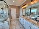 This bathroom features marble tiling, a glass shower, a soaking tub, and a dual vanity at 3251 Wilson Ct # 10, Lincolnton, NC 28092