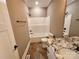 Well-lit bathroom with a shower-tub combo, granite vanity, and tile flooring providing a clean aesthetic at 3251 Wilson Ct # 10, Lincolnton, NC 28092