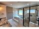This bathroom features marble tiling, a glass shower, a soaking tub, and a dual vanity at 3251 Wilson Ct # 10, Lincolnton, NC 28092