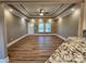 Open concept living space features trey ceilings, wood-look floors, and natural light from the windows and door at 3251 Wilson Ct # 10, Lincolnton, NC 28092