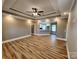 An open concept living space boasts beautiful trey ceiling, recessed lighting, and wood-look flooring at 3251 Wilson Ct # 10, Lincolnton, NC 28092