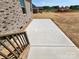 New construction home featuring concrete patio space with unfinished lawn and exterior brick at 3251 Wilson Ct # 10, Lincolnton, NC 28092