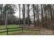 Secluded home with rustic fence and wooded surroundings at 12505 Old Beatty Ford Rd, Rockwell, NC 28138