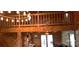 A spacious loft with wood railing is brightly lit by overhead lighting at 12505 Old Beatty Ford Rd, Rockwell, NC 28138