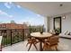 Relaxing balcony with outdoor furniture and city views at 130 Cherokee Rd # 404, Charlotte, NC 28207