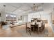 Open concept dining area with modern light fixture and hardwood floors at 130 Cherokee Rd # 404, Charlotte, NC 28207