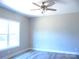 Bright bedroom with ceiling fan and large window at 325 Jordan Ave, Spencer, NC 28159