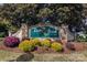 Deer Brook Golf Club entrance sign with manicured landscaping, flowers, and mature trees at 120-B Deer Brook Dr, Shelby, NC 28150