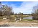 Scenic golf course view featuring a gazebo, pond, manicured greens, and mature trees at 120-B Deer Brook Dr, Shelby, NC 28150