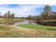 Picturesque view of a golf course with a pond, well-maintained greens, and mature trees at 120-B Deer Brook Dr, Shelby, NC 28150