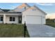 Newly constructed home with board and batten siding, a mailbox, and an attached two-car garage at 120-C Deer Brook Dr, Shelby, NC 28150