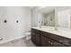 Bathroom features double sinks with dark cabinetry and a tile floor at 107 Gray Willow St, Mooresville, NC 28117