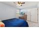 Cozy bedroom features a ceiling fan and television on a wooden dresser at 107 Gray Willow St, Mooresville, NC 28117