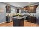 Well-equipped kitchen boasting granite countertops, stainless steel appliances, and a functional island at 107 Gray Willow St, Mooresville, NC 28117