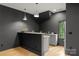 This cozy bar area features modern fixtures, counter seating, and updated decor at 4142 Pineview Rd, Charlotte, NC 28211