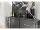 Chic bar area features custom cabinetry, gold fixtures, and elegant tile backsplash at 4142 Pineview Rd, Charlotte, NC 28211