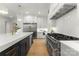 Elegant kitchen featuring stainless steel appliances, a large island, and a professional grade gas range at 4142 Pineview Rd, Charlotte, NC 28211