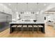 Spacious kitchen with a large island, white cabinets, stainless steel appliances, and ample seating at 4142 Pineview Rd, Charlotte, NC 28211